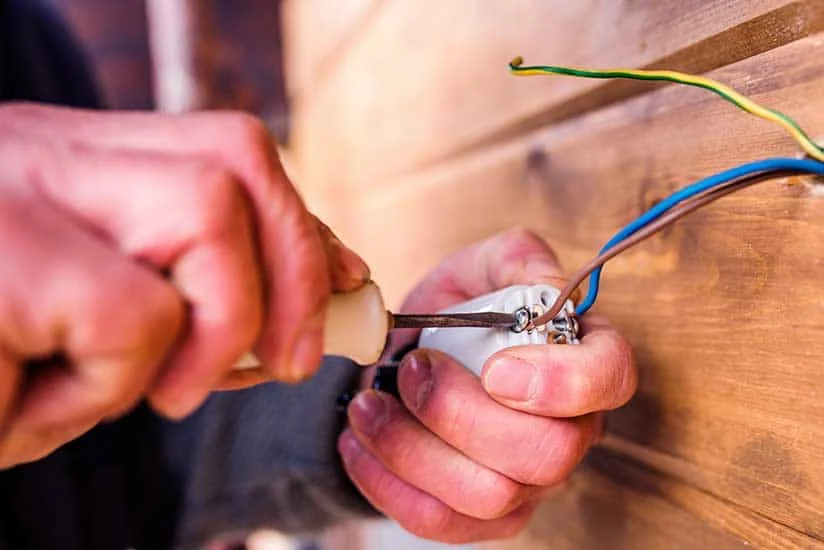 hands-of-unrecognizable-electrician-working